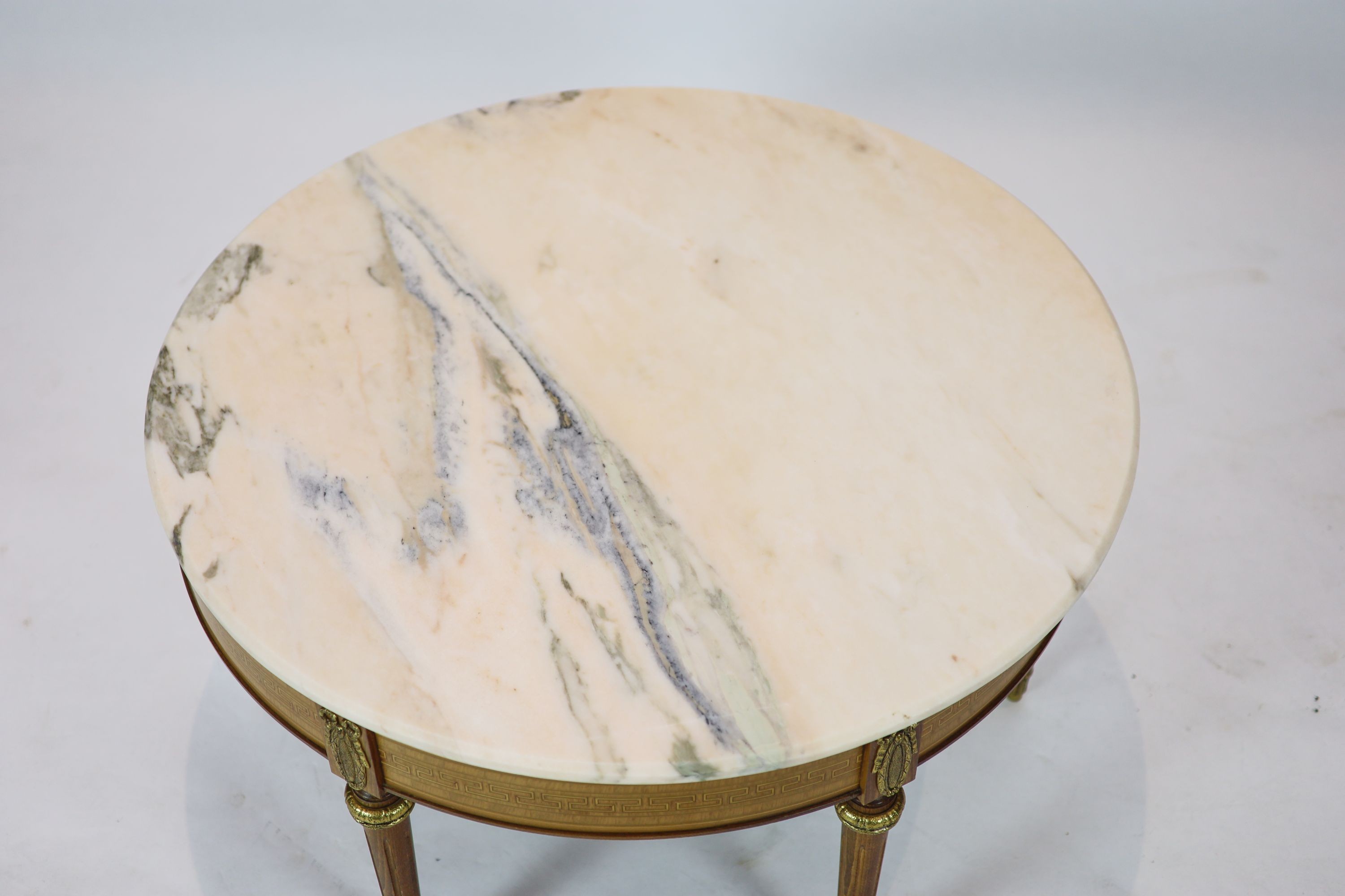 A Louis XVI inlaid mahogany circular marble topped table, diameter 86cm, height 46cm